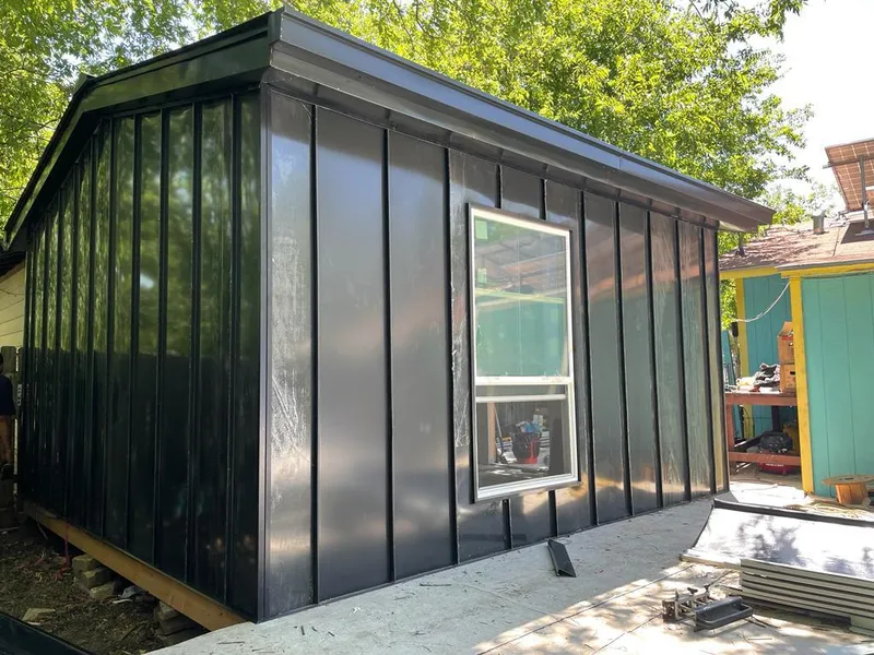 Black standing seam metal wall panels for Metal Roof Installation in Edgerton