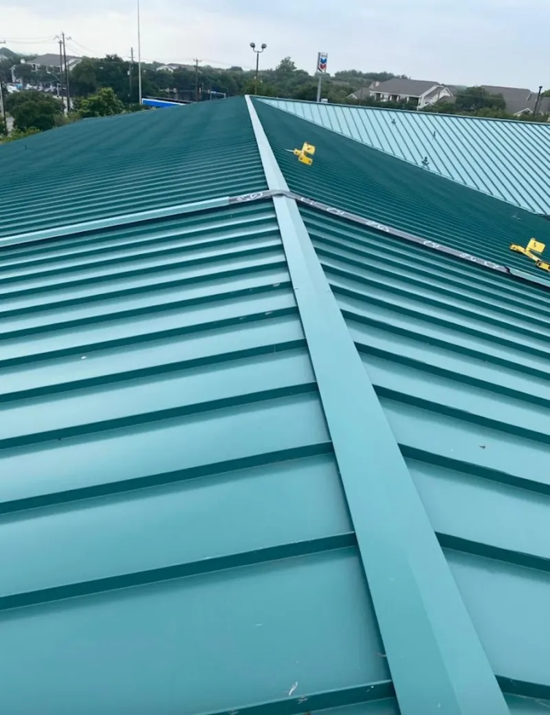 Green commercial metal roof ridge and valley for Metal Roof Repair in Edgerton