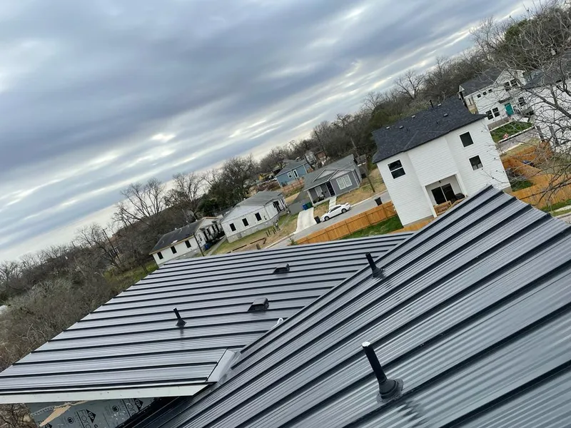 Standing seam metal roof panels with vents for Skylight Repair in Edgerton